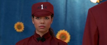 Movie still from “Johnson Family Vacation” (2004), directed by Christopher Erskin – A woman in a red uniform and a red hat; Close Up shot, High angle