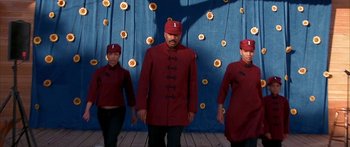 Movie still from “Johnson Family Vacation” (2004), directed by Christopher Erskin – A group of people standing next to each other on a wooden floor; Medium shot, Low angle