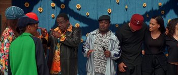 Movie still from “Johnson Family Vacation” (2004), directed by Christopher Erskin – A couple of men standing next to each other on a stage; Medium shot, High angle