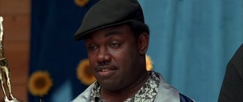 Movie still from “Johnson Family Vacation” (2004), directed by Christopher Erskin – A person wearing a hat; Close Up shot, High angle