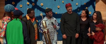 Movie still from “Johnson Family Vacation” (2004), directed by Christopher Erskin – A group of men standing next to each other holding trophies; Medium shot, Low angle