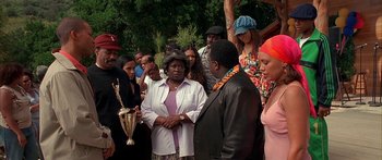 Movie still from “Johnson Family Vacation” (2004), directed by Christopher Erskin – A group of people standing around a tree; Medium shot, Over the shoulder angle