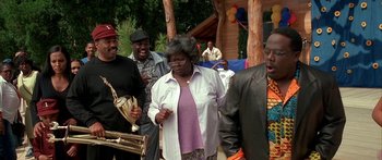 Movie still from “Johnson Family Vacation” (2004), directed by Christopher Erskin – A group of people standing next to each other; Medium shot, Low angle