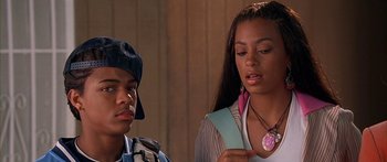 Movie still from “Johnson Family Vacation” (2004), directed by Christopher Erskin – A man and a woman looking at a piece of paper; Close Up shot, High angle