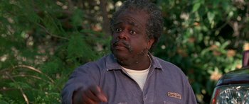 Movie still from “Johnson Family Vacation” (2004), directed by Christopher Erskin – A person wearing a shirt; Close Up shot, Low angle