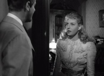 Movie still from “Kings Row” (1942), directed by Sam Wood – A man and a woman looking at each other in a room; Close Up shot, Over the shoulder angle