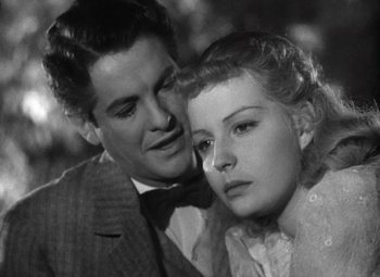 Movie still from “Kings Row” (1942), directed by Sam Wood – A black and white photo of a man and a woman; Close Up shot, Low angle