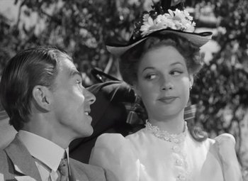 Movie still from “Kings Row” (1942), directed by Sam Wood – A man and a woman are looking at one another; Close Up shot, Over the shoulder angle