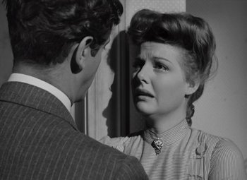 Movie still from “Kings Row” (1942), directed by Sam Wood – A man and a woman looking at each other in a mirror; Close Up shot, Over the shoulder angle