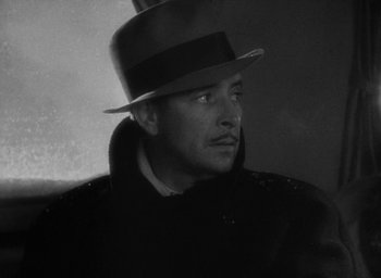 Movie still from “Lost Horizon” (1937), directed by Frank Capra – A black and white photo of a man wearing a hat; Close Up shot, Low angle
