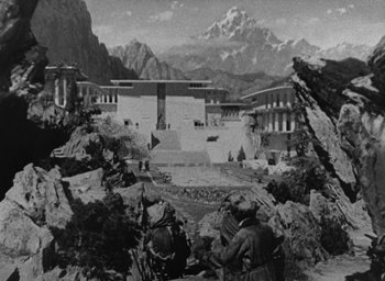 Movie still from “Lost Horizon” (1937), directed by Frank Capra – A black - and - white photo of a scene in a movie; Extreme Wide shot, High angle