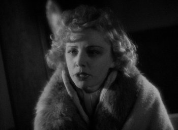 Movie still from “Lost Horizon” (1937), directed by Frank Capra – A black - and - white photo of a woman wearing a fur coat; Close Up shot, Low angle