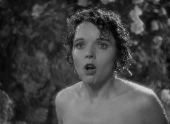 Movie still from “Lost Horizon” (1937), directed by Frank Capra – A woman with wet hair and bare chest in a black and white photo; Close Up shot, Low angle