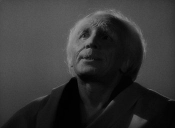 Movie still from “Lost Horizon” (1937), directed by Frank Capra – An older man with white hair looking upward; Close Up shot, Low angle