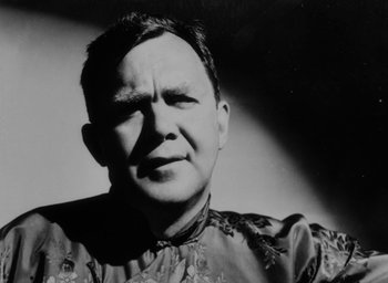 Movie still from “Lost Horizon” (1937), directed by Frank Capra – An old black and white photo of a man; Close Up shot, Low angle