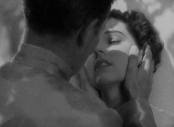 Movie still from “Lost Horizon” (1937), directed by Frank Capra – A man and a woman are looking in the same direction; Extreme Close Up shot, Overhead angle