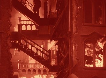 Movie still from “Mighty Joe Young” (1949), directed by Ernest B. Schoedsack – A building that has some fire in it; Extreme Wide shot, High angle