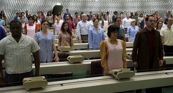 Movie still from “Mood Indigo” (2013), directed by Michel Gondry – A group of people standing in a stadium; Wide shot, High angle