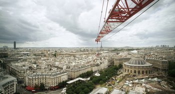 Movie still from “Mood Indigo” (2013), directed by Michel Gondry – A view of a large city from a crane; Extreme Wide shot, Low angle