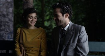 Movie still from “Mood Indigo” (2013), directed by Michel Gondry – A man and a woman smiling at each other; Close Up shot, High angle