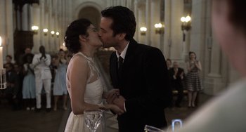 Movie still from “Mood Indigo” (2013), directed by Michel Gondry – A man and a woman kissing in front of an audience; Close Up shot, Over the shoulder angle