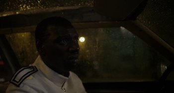 Movie still from “Mood Indigo” (2013), directed by Michel Gondry – A man in white shirt looking out of a window; Close Up shot, High angle
