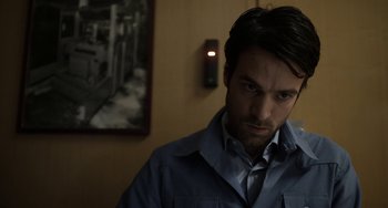 Movie still from “Mood Indigo” (2013), directed by Michel Gondry – A person wearing a shirt; Close Up shot, Over the shoulder angle