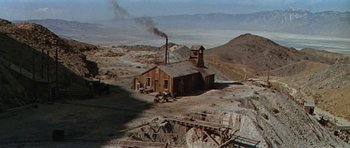 Movie still from “Nevada Smith” (1966), directed by Henry Hathaway – An old wooden building in the middle of the desert; Extreme Wide shot, High angle