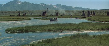 Movie still from “Nevada Smith” (1966), directed by Henry Hathaway – A group of people in a boat on a body of water; Extreme Wide shot, High angle