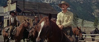 Movie still from “Nevada Smith” (1966), directed by Henry Hathaway – A group of men riding on the backs of horses; Medium shot, Low angle