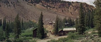 Movie still from “Nevada Smith” (1966), directed by Henry Hathaway – An old time scene of a gold mining town; Extreme Wide shot, High angle