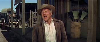 Movie still from “Nevada Smith” (1966), directed by Henry Hathaway – An older man wearing a cowboy hat and jacket; Medium shot, Low angle