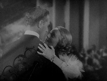 Movie still from “Of Human Bondage” (1934), directed by John Cromwell – A man and a woman dancing together in a ballroom; Close Up shot, High angle