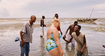 Movie still from “Paradise: Love” (2012), directed by Ulrich Seidl – A group of people standing in shallow water; Wide shot, High angle