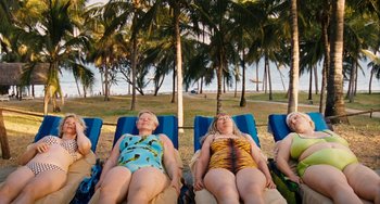 Movie still from “Paradise: Love” (2012), directed by Ulrich Seidl – A group of women laying on beach chairs; Wide shot, High angle