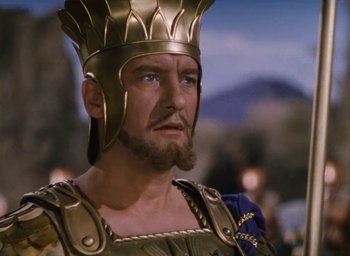 Movie still from “Samson and Delilah” (1949), directed by Cecil B. DeMille – A person wearing a helmet with a beard; Close Up shot, Low angle