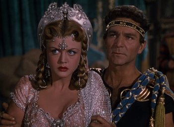 Movie still from “Samson and Delilah” (1949), directed by Cecil B. DeMille – A man and a woman standing next to each other; Close Up shot, Over the shoulder angle