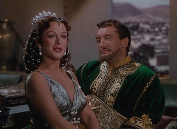 Movie still from “Samson and Delilah” (1949), directed by Cecil B. DeMille – A man and a woman dressed in medieval garb; Medium shot, Over the shoulder angle