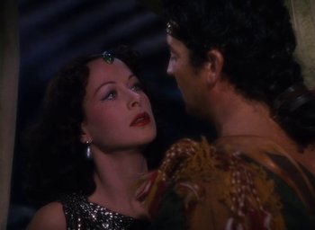 Movie still from “Samson and Delilah” (1949), directed by Cecil B. DeMille – A man and a woman standing next to each other; Close Up shot, Over the shoulder angle