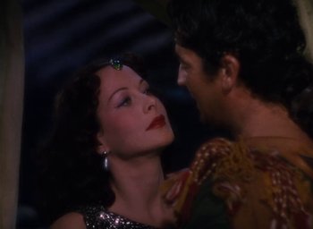 Movie still from “Samson and Delilah” (1949), directed by Cecil B. DeMille – A man and a woman are kissing each other; Close Up shot, Over the shoulder angle