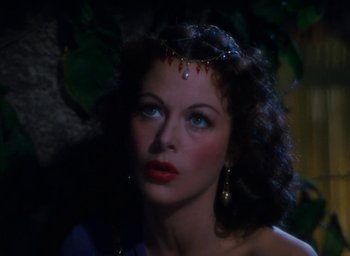 Movie still from “Samson and Delilah” (1949), directed by Cecil B. DeMille – A beautiful woman with blue eyes wearing a crown; Close Up shot, High angle