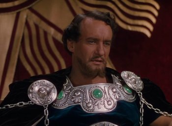 Movie still from “Samson and Delilah” (1949), directed by Cecil B. DeMille – A person wearing a costume; Close Up shot, High angle