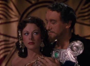 Movie still from “Samson and Delilah” (1949), directed by Cecil B. DeMille – A man and a woman are standing next to each other; Close Up shot, Over the shoulder angle