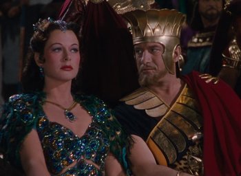 Movie still from “Samson and Delilah” (1949), directed by Cecil B. DeMille – A man and a woman dressed in costumes; Medium shot, High angle