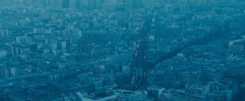 Movie still from “Simon Killer” (2012), directed by Antonio Campos – An aerial view of a busy city at night; Extreme Wide shot, High angle