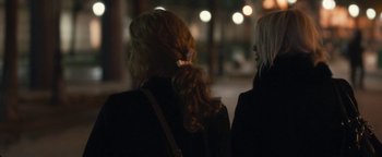 Movie still from “Simon Killer” (2012), directed by Antonio Campos – Two women walking down a street at night; Close Up shot, Over the shoulder angle
