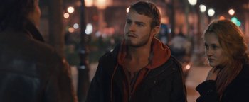 Movie still from “Simon Killer” (2012), directed by Antonio Campos – A man in a black jacket is standing in the street; Close Up shot, Over the shoulder angle