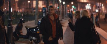 Movie still from “Simon Killer” (2012), directed by Antonio Campos – A man in a black jacket is walking down the street; Medium shot, Over the shoulder angle