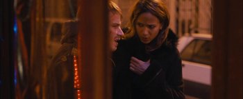 Movie still from “Simon Killer” (2012), directed by Antonio Campos – A man and a woman standing next to each other; Close Up shot, Over the shoulder angle