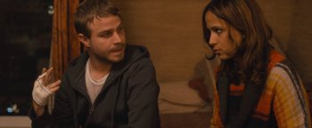 Movie still from “Simon Killer” (2012), directed by Antonio Campos – A man and a woman sitting next to each other; Close Up shot, Over the shoulder angle